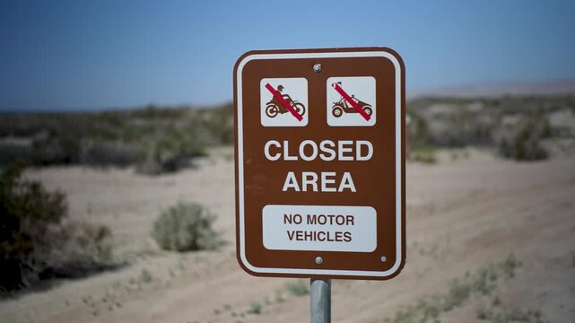 Signs at Salton Sea Recreation Area show closed areas that restrict motor vehicles in the campground in California