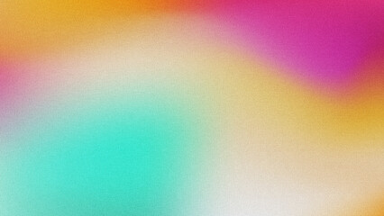 Fototapeta premium A soft, colorful gradient abstract background with fine-grained noise texture, blending warm gold, magenta, and cool mint tones.