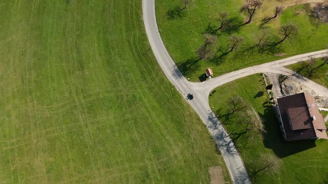 Motorcycles riding through green spring countryside near Lake Constance, Allg&auml;u, Germany