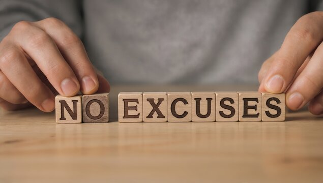 Hands arranging wooden blocks spelling no excuses on wooden table