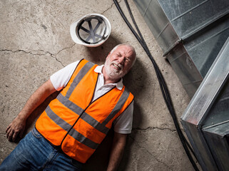 Fototapeta premium Construction worker accident injury safety workplace senior man Construction worker accident injury safety workplace senior