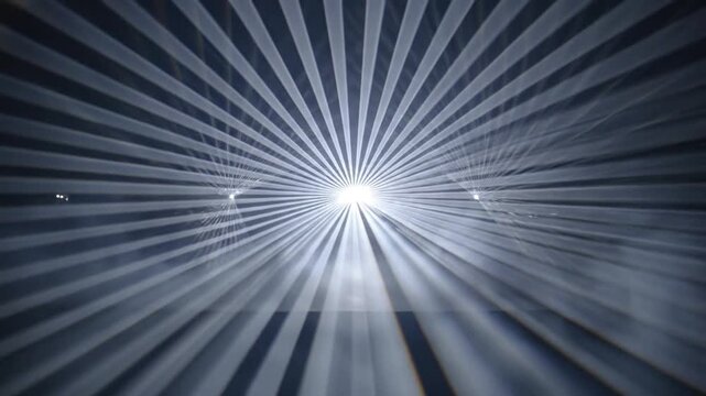 Radiant light beams converging and diverging from a central point creating a dynamic abstract pattern.