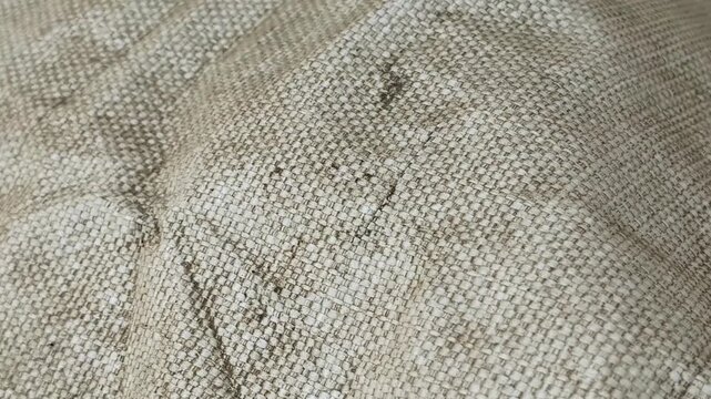 Close-up of woven polypropylene fabric texture. Industrial big bag sack surface with detailed fiber pattern. Synthetic material pan.