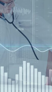 Vertical video: Doctor leaning placing stethoscope on patient medical HUD charts guiding listening