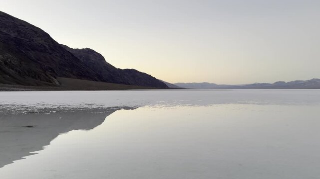 Flooded Badwater Basin Reflects Cliff Wall at Blue Hour