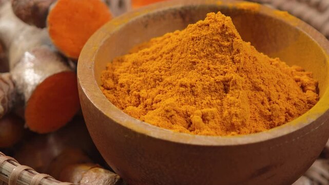 Turmeric powder in a cup.