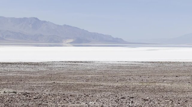 Telephoto Pan Over Pure White Badwater Basin Salt Flat