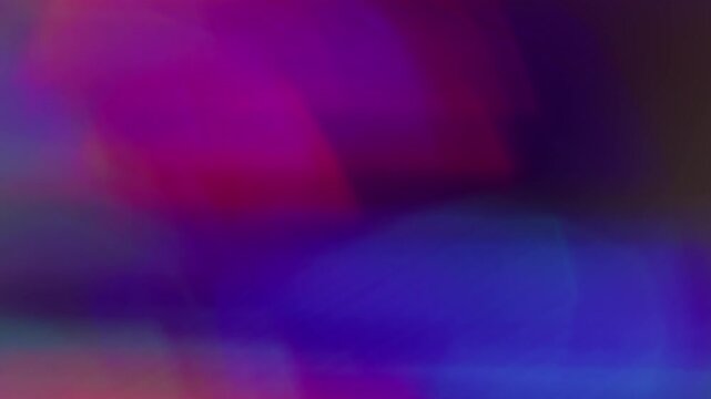 Defocused lens shine. Neon leak. Red violet green crystal reflection luminosity blending on black background kaleidoscope color twinkle.