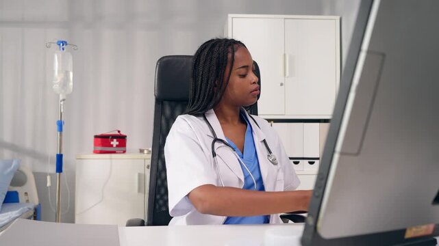 African female doctor use laptop give medical advice to online patient. 