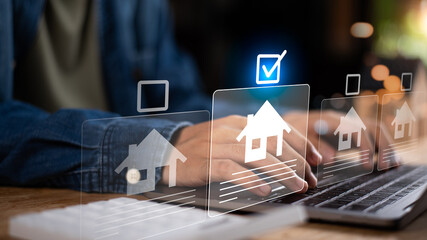 real estate investor compares digital home listings on laptop, reviewing property data, mortgage...