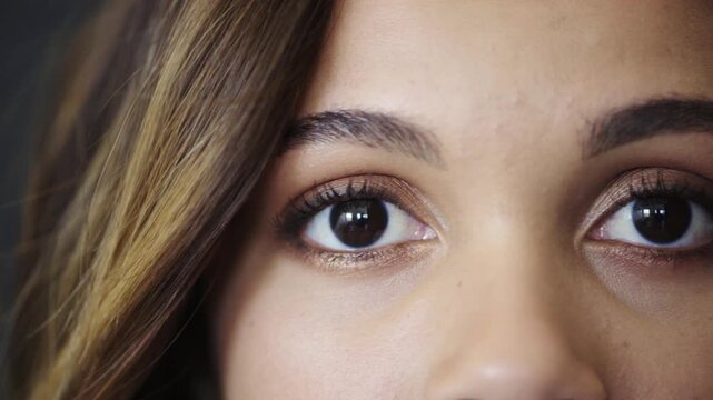 Ophthalmology, eye care and face of woman in studio with contact lenses for prescription for eyesight. Wellness, optical health and portrait of person by gray background with vision or optometry test