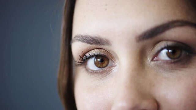 Optometry, eye health and portrait of woman in studio with contact lenses for prescription for eyesight. Wellness, optical care and person by gray background with vision, test or ophthalmology.