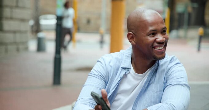 Notification popping, man in blue shirt sitting in plaza, smiling, rotating phone, playing game