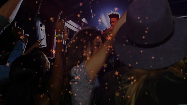 Lead fan raising arms while singer singing into mic, music fans cheering, star effect drifting