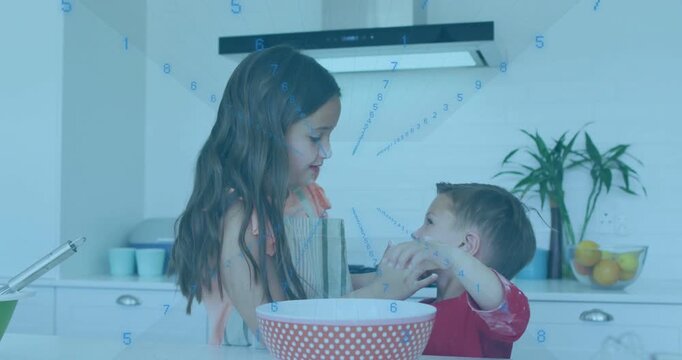 Vertical video: Girl guiding boy dabbing bowl mix on cheeks as blue graphic showing cooking motion