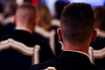 Protection and Guard Service (SPP, Romanian version of the US Secret Service) officer in public during the speech of a dignitary