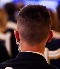 Protection and Guard Service (SPP, Romanian version of the US Secret Service) officer in public during the speech of a dignitary