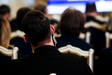 Protection and Guard Service (SPP, Romanian version of the US Secret Service) officer in public during the speech of a dignitary