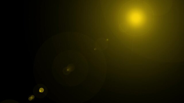 Abstract lens flare in a black background. Sunlight lens flare golden shining alpha channel animation, digital flare effect. Modern flare and sun light video motion.