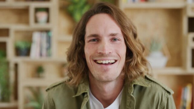 Face, funny and business man in agency as screenwriter, about us and excited for career. Portrait, worker and professional employee laughing, script writer and happy person in creative office in Uk