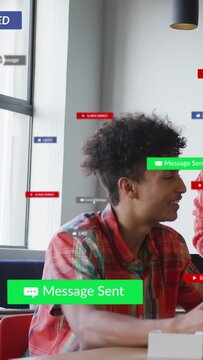 Vertical video: Seated man using device after colleague tap, chat UI sending banner for tech team