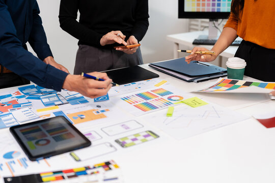UX developer and ui designer brainstorming about mobile app interface wireframe design with customer breif and color code, User experience concept.