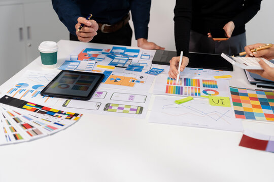 UX developer and ui designer brainstorming about mobile app interface wireframe design with customer breif and color code, User experience concept.
