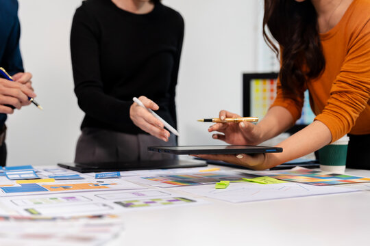 UX developer and ui designer brainstorming about mobile app interface wireframe design with customer breif and color code, User experience concept.