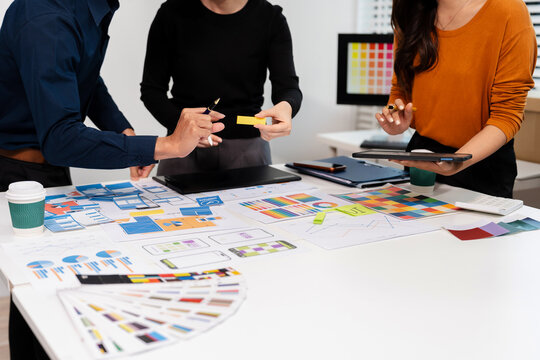 UX developer and ui designer brainstorming about mobile app interface wireframe design with customer breif and color code, User experience concept.