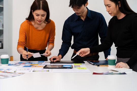 UX developer and ui designer brainstorming about mobile app interface wireframe design with customer breif and color code, User experience concept.