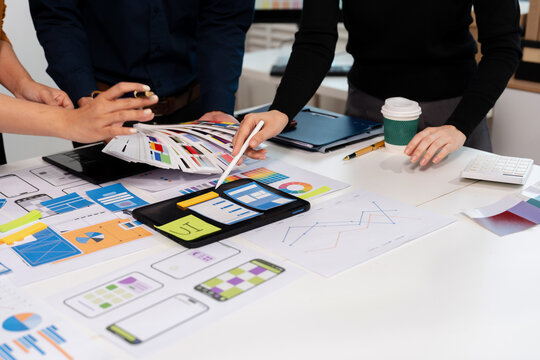UX developer and ui designer brainstorming about mobile app interface wireframe design with customer breif and color code, User experience concept.