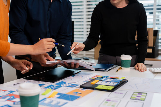UX developer and ui designer brainstorming about mobile app interface wireframe design with customer breif and color code, User experience concept.