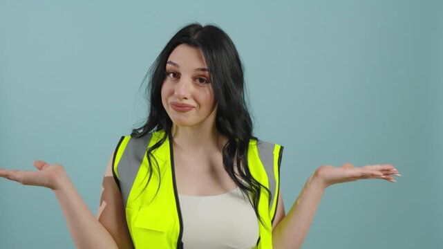 Woman in a reflective safety vest shrugging her shoulders
