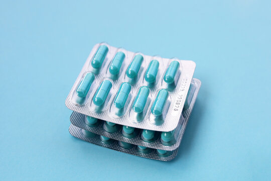 Blue capsules of Doxycycline in blister packs.