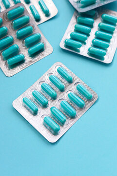 Blue capsules of Doxycycline in blister packs.