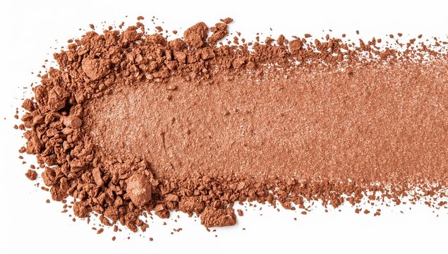 Crushed shimmery bronze powder spread on white background for makeup and beauty product design