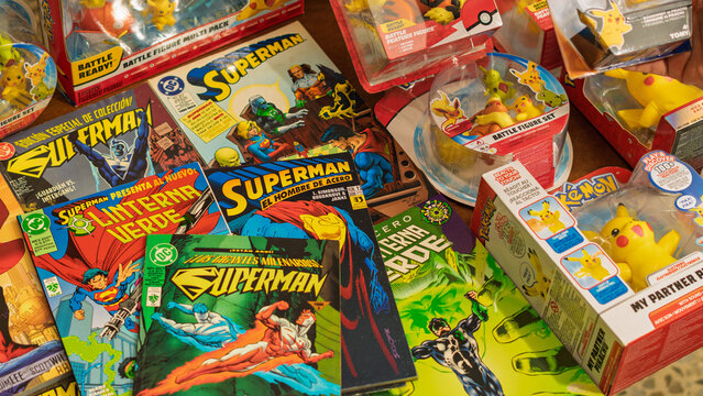 Guayaquil, Ecuador &ndash; August 10, 2024: Vintage Superman comic books and Pok&eacute;mon toys displayed at a collectible market, reflecting nostalgia, pop culture fandom and retro entertainment trends.