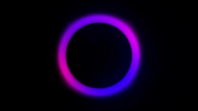 Glowing neon light circles create a dark solar eclipse design with blue energy rings and bright fire patterns on a black wallpaper space illustration