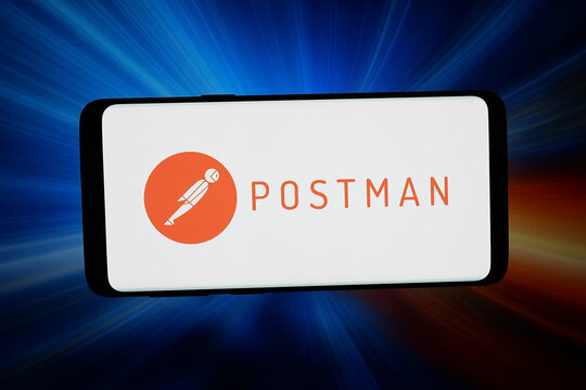 Stuttgart, Germany - 03-18-2026: In this photo illustration, the logo of software testing company Postman Inc. is displayed on a smartphone in front of abstract background on computer screen.