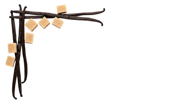 A decorative corner arrangement of dark vanilla beans and light brown sugar cubes on a white background.
