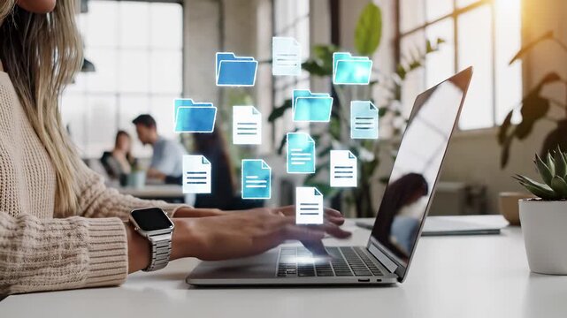 Woman typing on laptop with digital document and folder icons above keyboard in office. File management and sharing cloud workflow system. Business paperless data organization and transfer technology