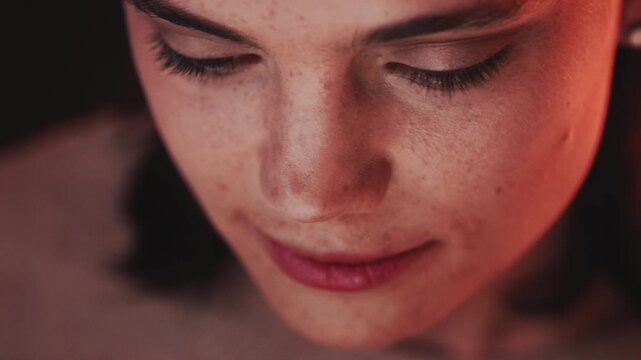 Face, reaction to memory and smile of woman at night for contemplation, nostalgia or reflection. Dark, funny thought and remember with happy person thinking of idea, opportunity or perspective