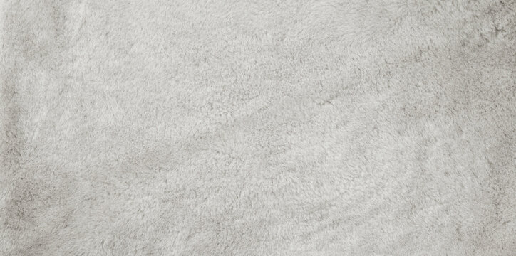 Light gray fur texture background with soft fluffy fibers and natural material surface. Perfect for fashion design, winter concepts, interior decor, mockups, banners, templates, branding, packaging