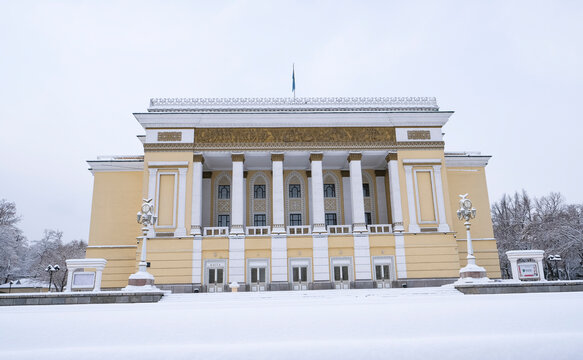 3.3.2026 Almaty, Kazakhstan. Abai Opera and Ballet Theatre in Almaty after snowfall. Historic building surrounded by fresh snow, elegant winter cityscape in Kazakhstan.