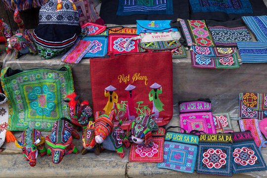 Handmade textile goods for sale at the weekend market in Sapa, Vietnam. These goods are made by the local Hmong people and sold to tourists visiting the area.