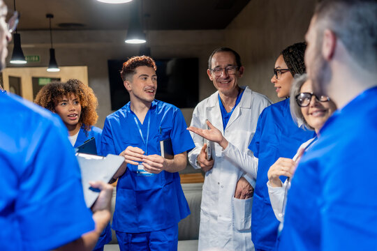 Diverse medical professionals discussing patient care, working as a team