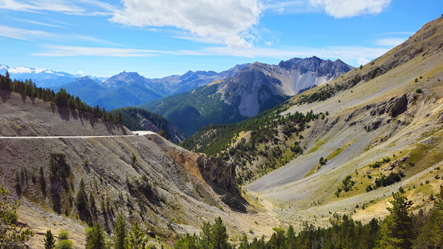 Mountain landscape with winding road near Col d&rsquo;Izoard mountain pass, French Alps, Hautes Alpes, France, Europe.