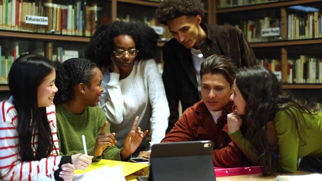 Diverse group of students collaborating in a library