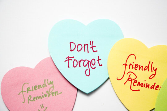 Text dont forget colorful sticky notes paper. Business concept