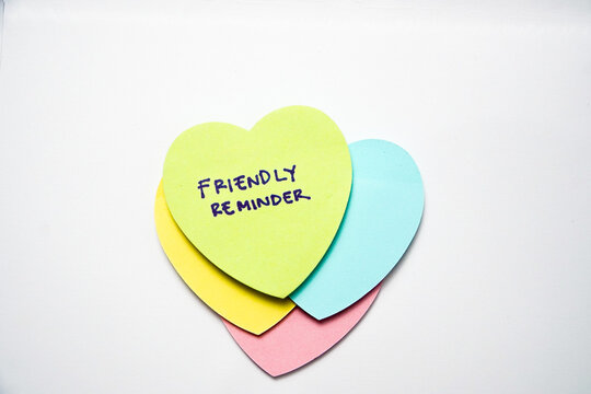Text friendly reminder colorful sticky notes paper. Business concept